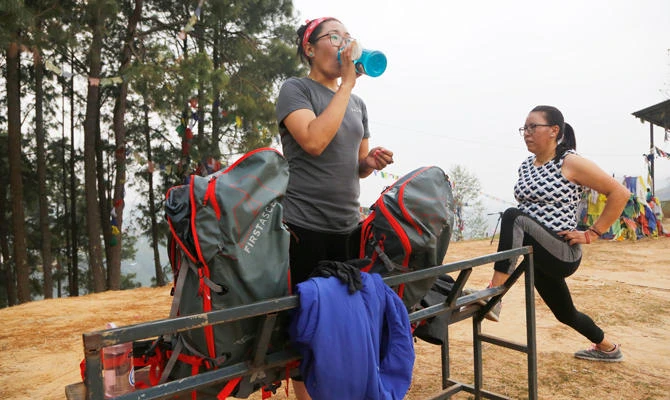 In this photo taken Saturday, March 30, 2019, Nima Doma, 34, left, and Furdiki Sherpa, 43, perform morning exercises as they train to summit Mount Everest, in Kathmandu, Nepal. (AP)