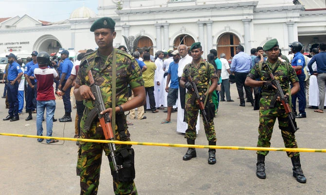 Sri Lankan security personnel keep watch outside the church premises following a blast at the St. Anthony's Shrine in Kochchikade in Colombo on April 21, 2019. (AFP)