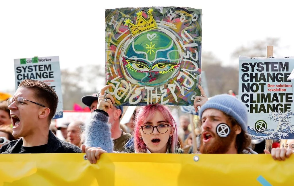 Environmental protesters from the Extinction Rebellion stage a demonstration in Parliament Square in London on April 15, 2019. (AFP)