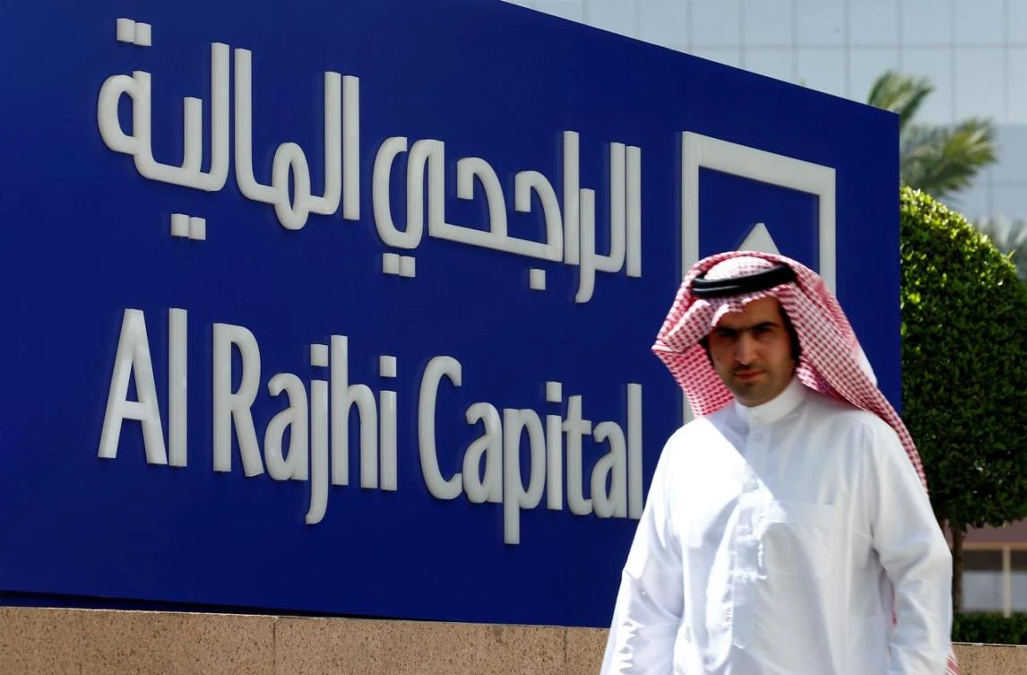 A man walks past a sign of Al Rajhi Capital company in Riyadh, Saudi Arabia, November 8, 2017. (Reuters)