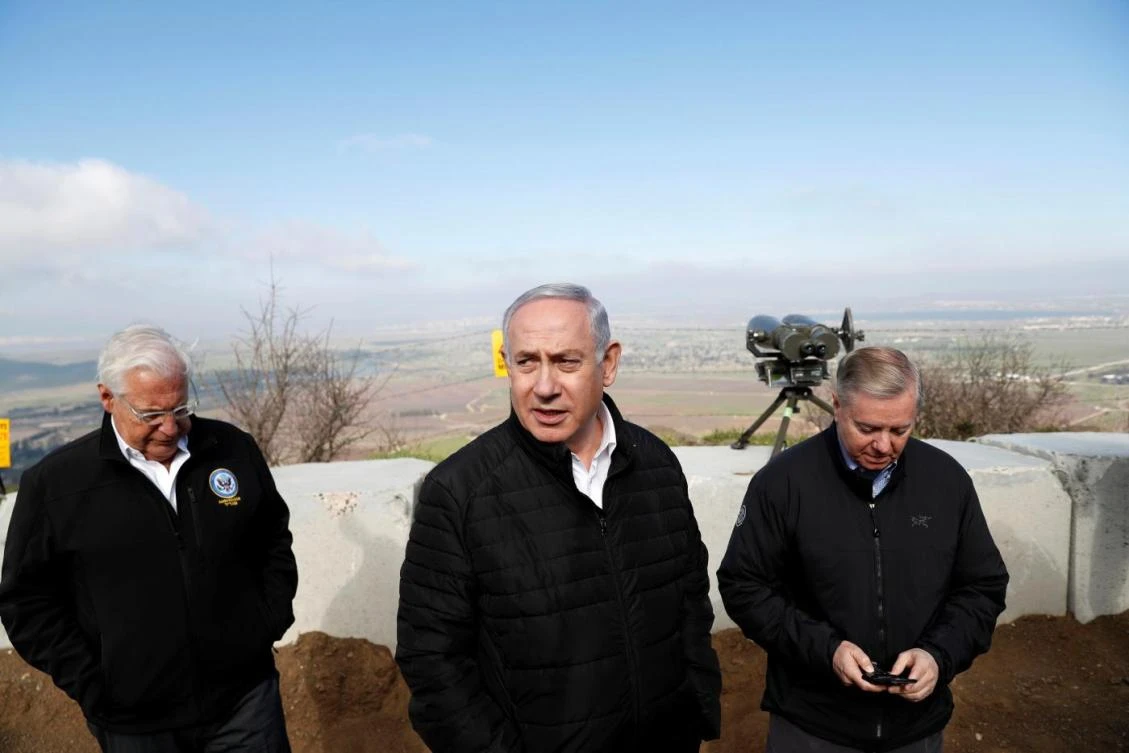 Benjamin Netanyahu, Republican Senator Lindsey Graham, right, and US ambassador to Israel David Friedman visit the border between Israel and Syria at the Israeli-occupied Golan Heights. (Reuters)