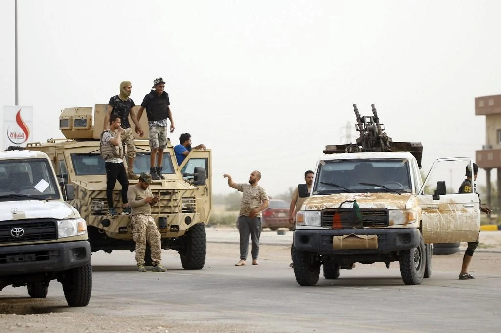 The fighting between Libyan National Army and other armed militant groups in Tripoli is near some migrant facilities. (AFP/File)