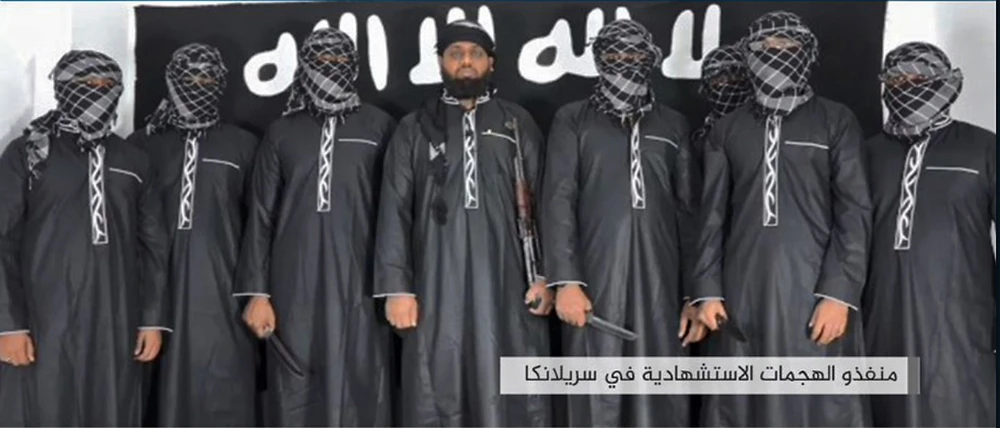 An image grab taken from a press release issued on April 23, 2019 by the Daesh propaganda agency Amaq claims to show eight men it said carried out a string of deadly suicide bomb blasts on Easter Sunday in Sri Lanka, lined up at an undisclosed location. (AFP)