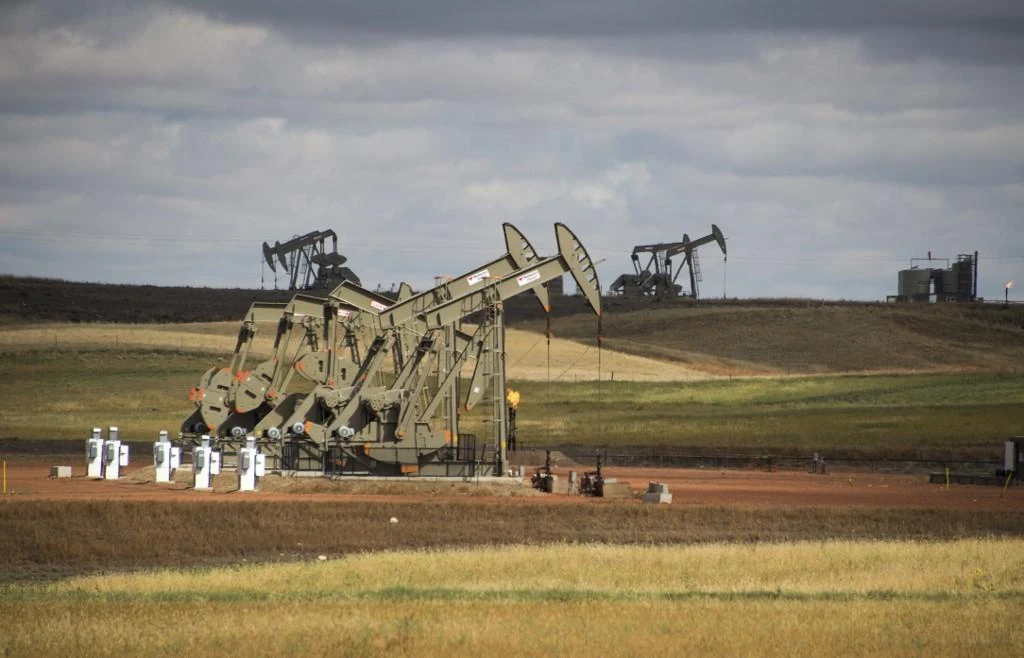 US crude oil production has risen to a record of 12.2 million barrels per day. (AFP)