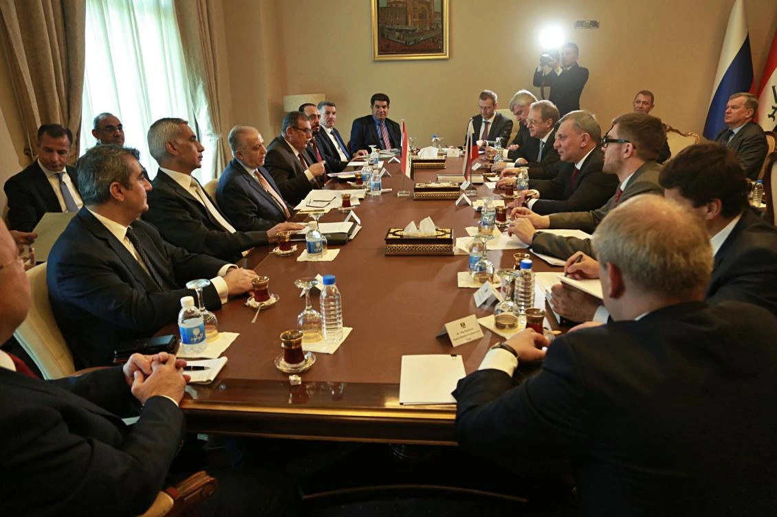 An Iraqi delegation, left, led by Foreign Minister Mohamed Alhakim, holds a meeting with the Russian delegation, led by the Deputy Chairman of the Russian Federation Yury Borisov, in Baghdad, Iraq on April 25. (AP)