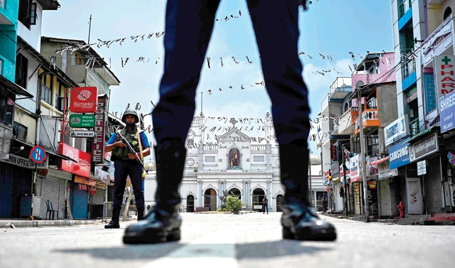 Soldiers stand guard on Thursday outside St. Anthony’s Shrine in Colombo that was attacked on Sunday. (AFP)