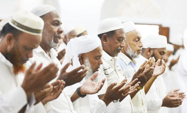 People perform Friday prayers at a mosque in Kattankudy. (AFP)