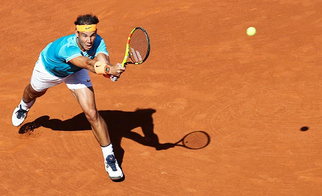 Rafael Nadal of Spain plays a shot against Jan-Lennard Struff of Germany during a quarterfinal match at the Barcelona Open Tennis Tournament in Barcelona, Spain, Friday, April 26, 2019. (AP)