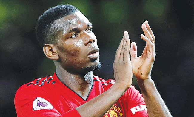 Manchester United’s Paul Pogba applauds fans after a match against Manchester City. (Reuters)