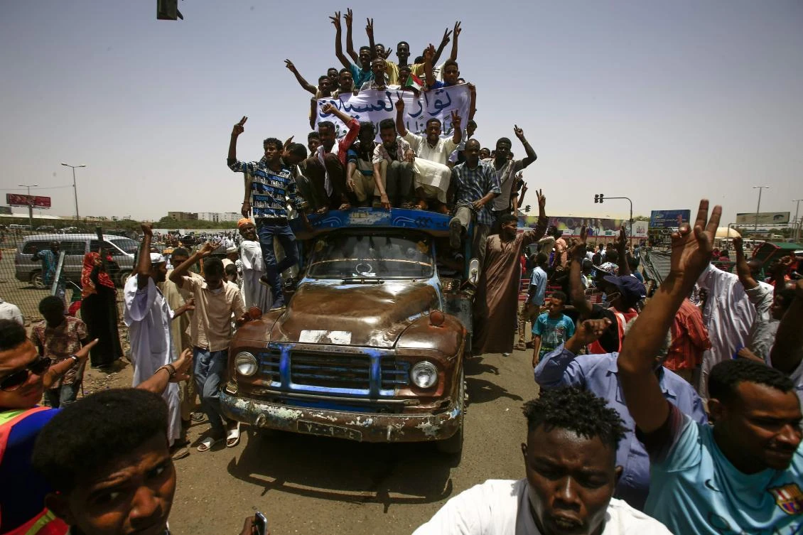 Sudanese protesters gather near the military headquarters in the capital Khartoum, during a rally on April 27, 2019. (AFP)