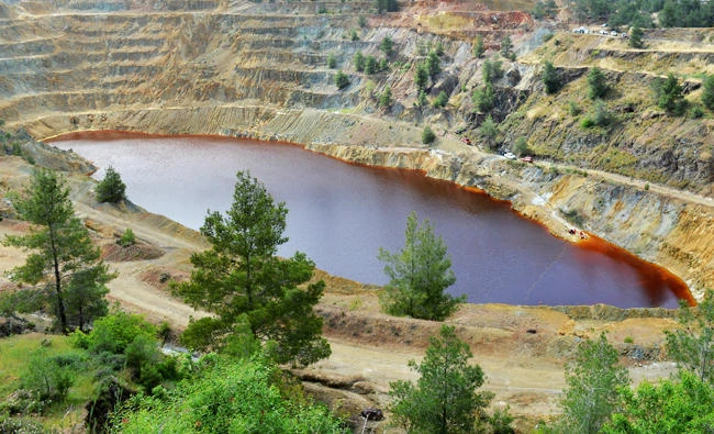 View of Kokkinopezoula lake, also known as "red lake" where forensics officers search for possible bodies of victims of a suspected serial killer, near the village of Mitsero, Cyprus, April 27, 2019. (REUTERS)