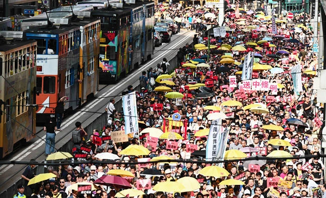 Activists attend a protest in Hong Kong on April 28, 2019, against a controversial move by the government to allow extraditions to the Chinese mainland. (AFP)
