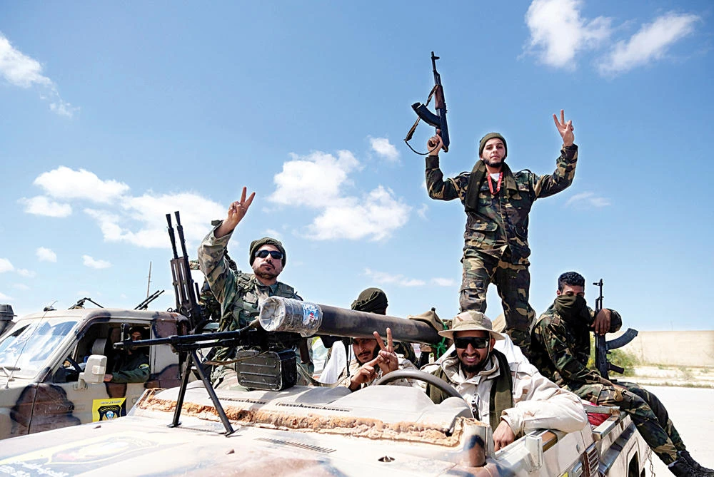 Libyan National Army (LNA) members head out of Benghazi to reinforce troops advancing toward Tripoli. (Reuters/File photo)