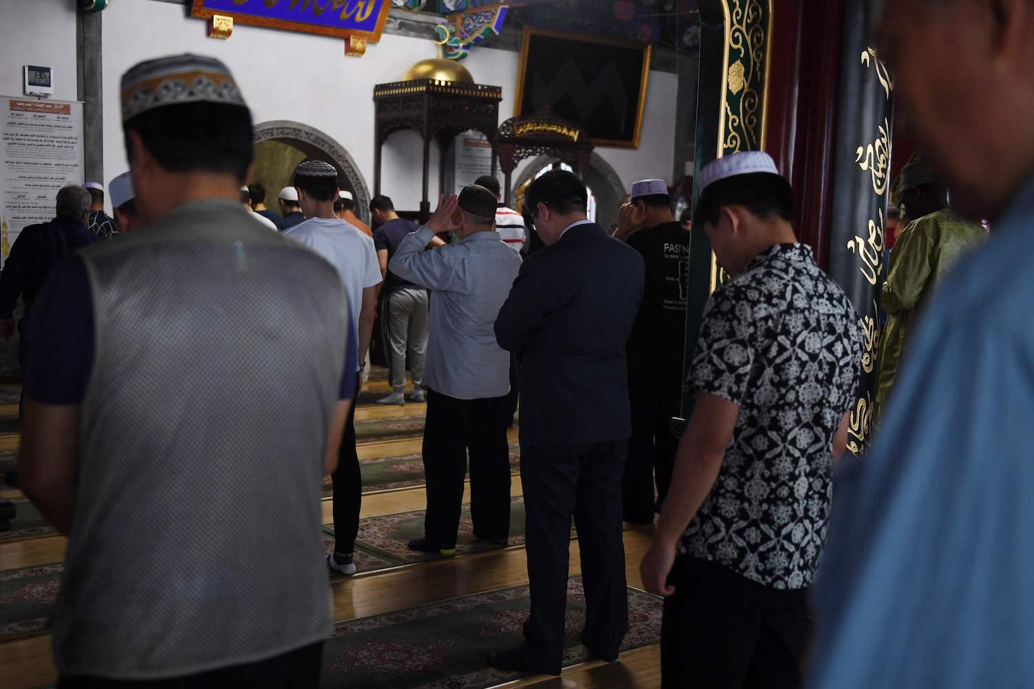 Muslim men pray on the first Friday of Ramadan at a mosque in Beijing on May 10, 2019. (AFP)