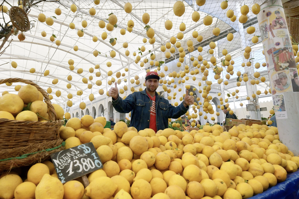 A Tunisian vendor sells fruits at a central market in Tunis during  the Muslim holy month of Ramadan on May 7, 2019. (AFP)