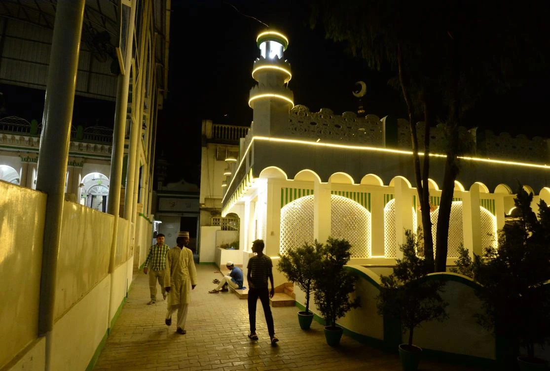 Nepali Muslim men walk after prayers before breaking their fast at the Kashmiri Mosque on the first day of the Muslim holy month of Ramadan, in Kathmandu on May 7, 2019. Muslims throughout the world are marking the month of Ramadan, the holiest month in the Islamic calendar during which Muslims fast from dawn until dusk. / AFP / PRAKASH MATHEMA