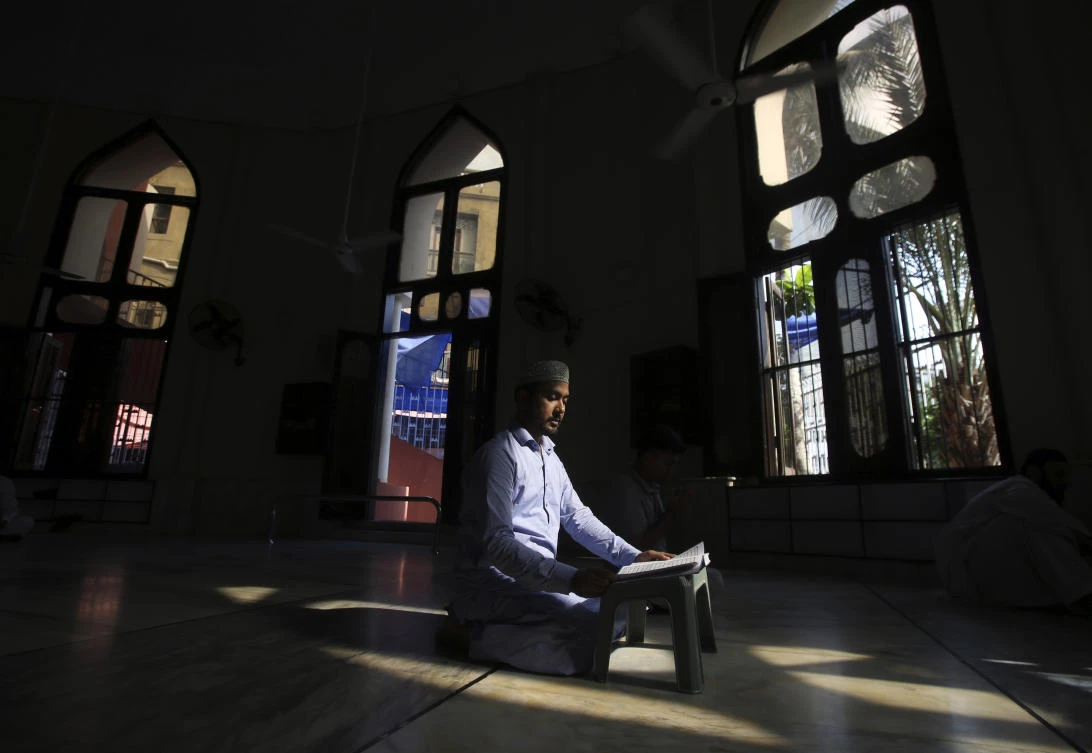 A Pakistan Muslim recites the Quran during the fasting month of Ramadan at a mosque in Karachi Pakistan, Tuesday, May 7, 2019. Muslims around the world are observing Ramadan, the holiest month in Islamic calendar. (AP Photo/Fareed Khan)