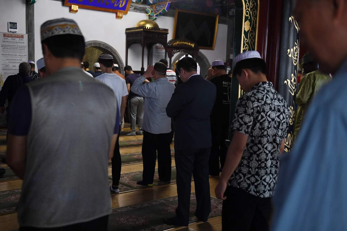 Muslim men pray on the first Friday of Ramadan at a mosque in Beijing on May 10, 2019. (AFP)