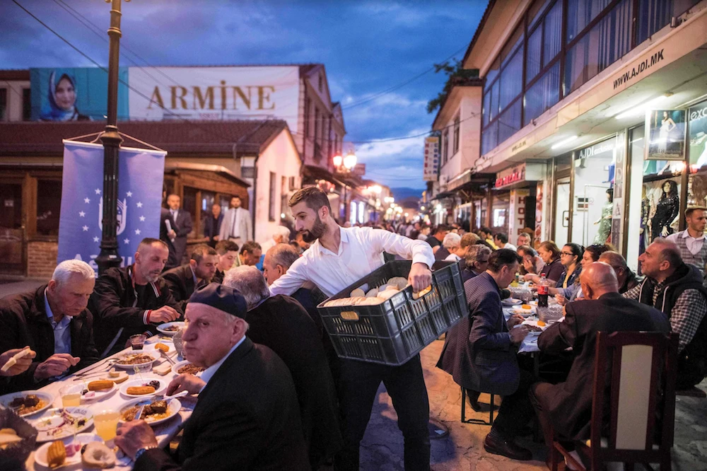 People gather at the Old Bazaar for the iftar dinner, the meal to end their daily fast, during the holy month of Ramadan in Skopje on May 18, 2019. (AFP)