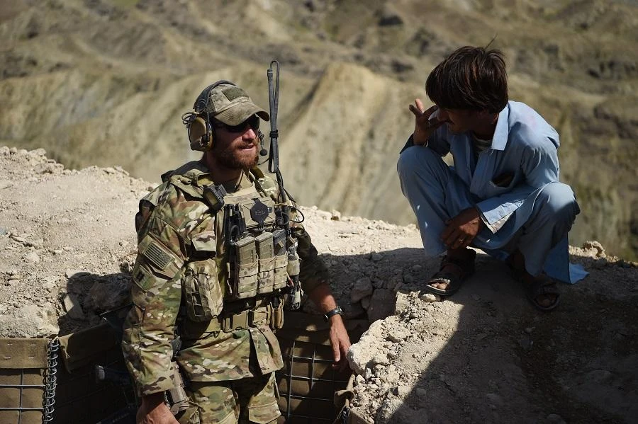 In this photo taken on July 7, 2018, A US Army soldier from NATO and an Afghan Local Police (ALP) look on in a checkpoint. (File/AFP)