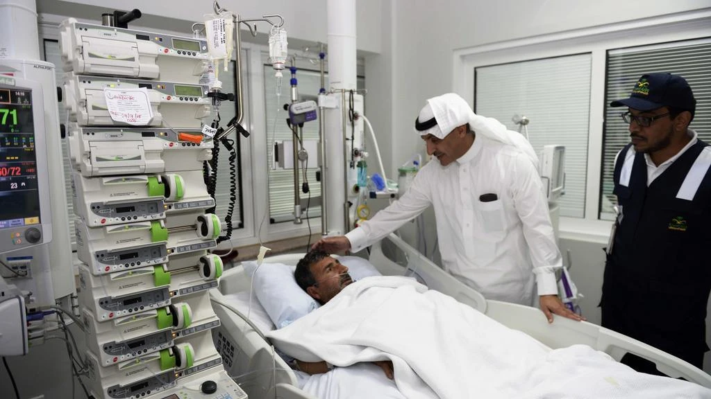 The Ministry of Health said that it will seek proposals from international suppliers for a project valued at more than SR250m. Above, a health ministry official visits a patient in a Saudi hospital. (AP Photo)