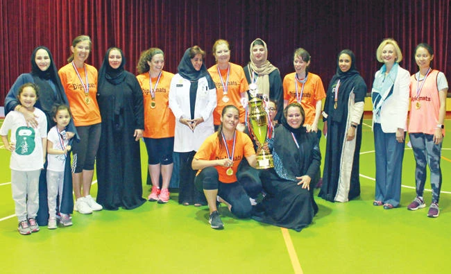 The Riyadh United and the Diplomatic teams with the trophy at the end of the basketball championship. (Photo/Supplied)