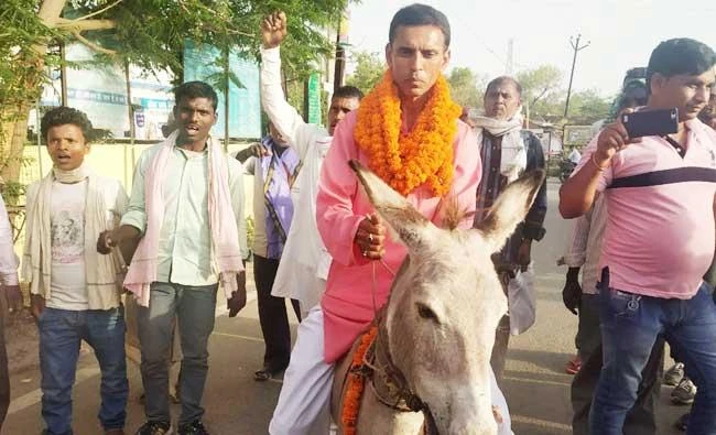 India politician charged after donkey ride to file papers