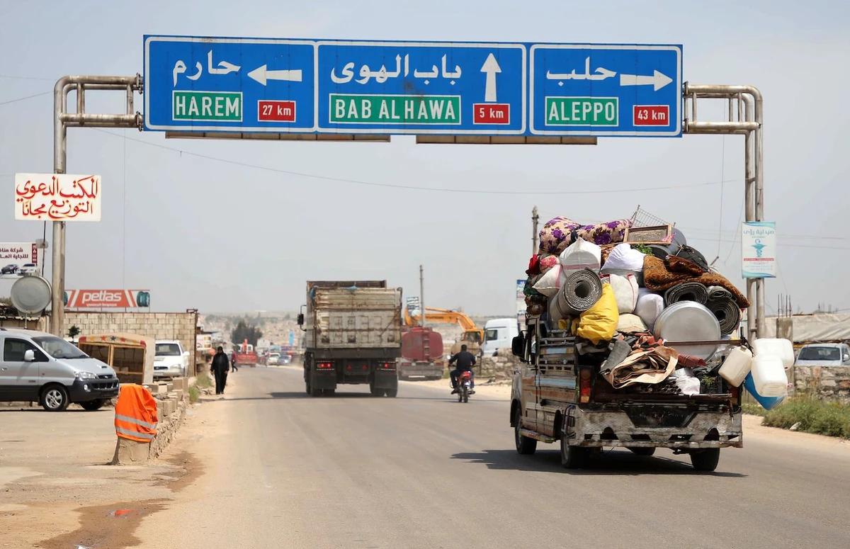 A picture taken on May 1, 2019 shows a truck loaded with belongings of a family as they flee from reported regime shelling on Hama and Idlib provinces. (AFP)