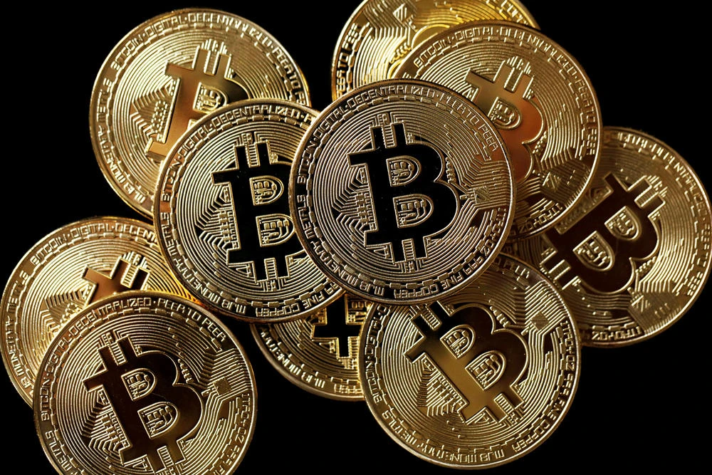 A collection of Bitcoin (virtual currency) tokens are displayed in this picture illustration taken December 8, 2017. (REUTERS file photo)