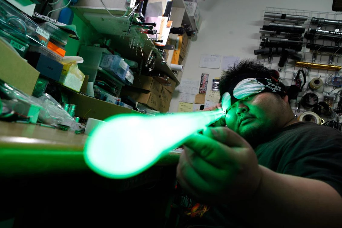 In this picture taken on April 22, 2019, Makoto Tsai, who handcrafts lightsabers for Star Wars fans, poses for a photograph at his workshop in New Taipei City. (AFP/Hsu Tsun-hsu)