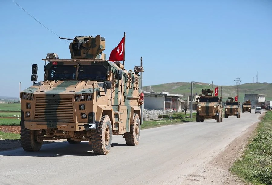A column of armoured Turkish military vehicles drives on a patrol along a road in the de-militarised zone in the western countryside of Syria's Aleppo province near the town of Al-Eis on March 8, 2019. (File/AFP)