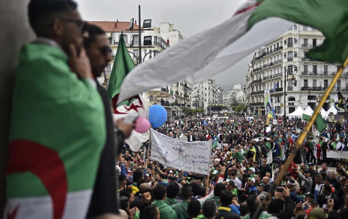 Algerian protesters wave a national flag as they take part in a demonstration in the capital Algiers on May 3, 2019. (AFP)