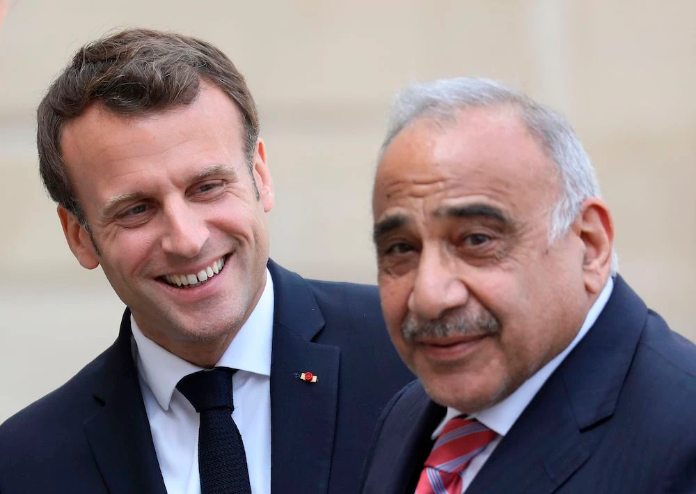 France's President Emmanuel Macron welcomes Iraq's Prime Minister Adel Abdul-Mahdi before a meeting at the Elysee Palace in Paris, on Friday. (AFP)
