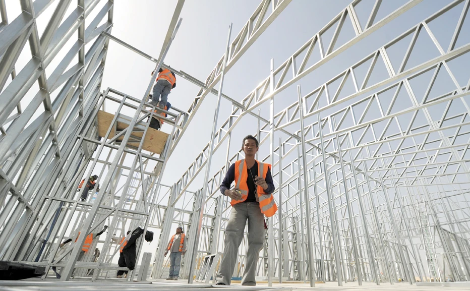 Civilian contractors from the Philippines build a church for foreign troops in Helmand province, southern Afghanistan. (AFP file photo)