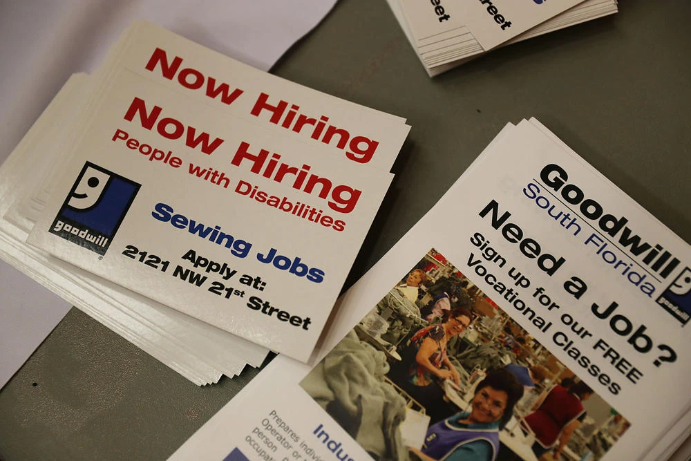 In this file photo taken on April 04, 2019, now hiring paperwork is seen on the Goodwill South Florida desk during a job fair put on by Miami-Dade County and other sponsors in Miami, Florida. The United States had another giant month of job creation in April, confirming the strength of the world's largest economy as President Donald Trump prepares to fend off challengers in next year's election. (AFP / GETTY IMAGES NORTH AMERICA / JOE RAEDLE)
