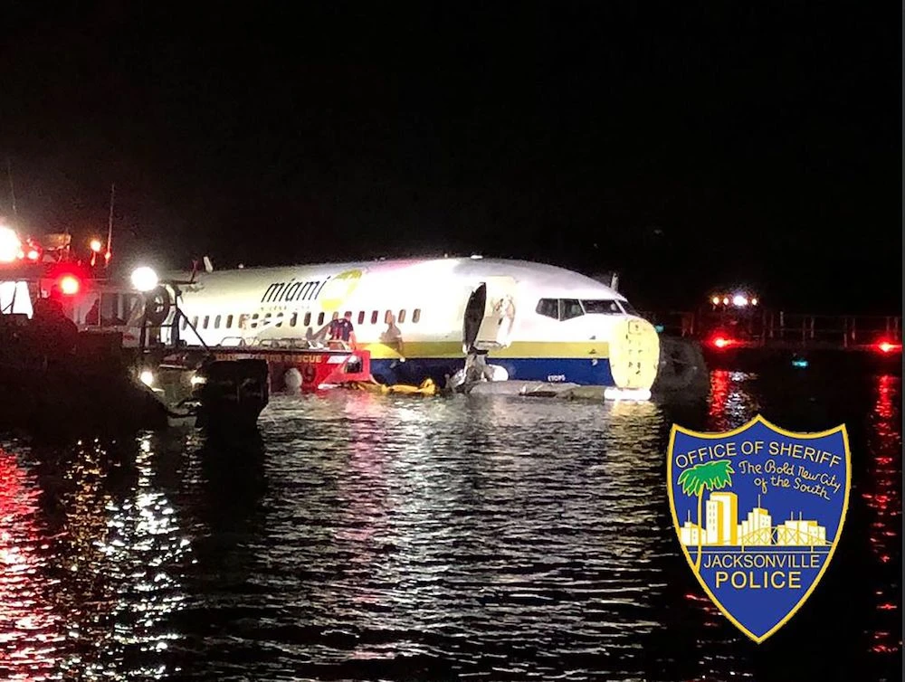 Boeing 737 slides off runway into Florida river, 21 hurt