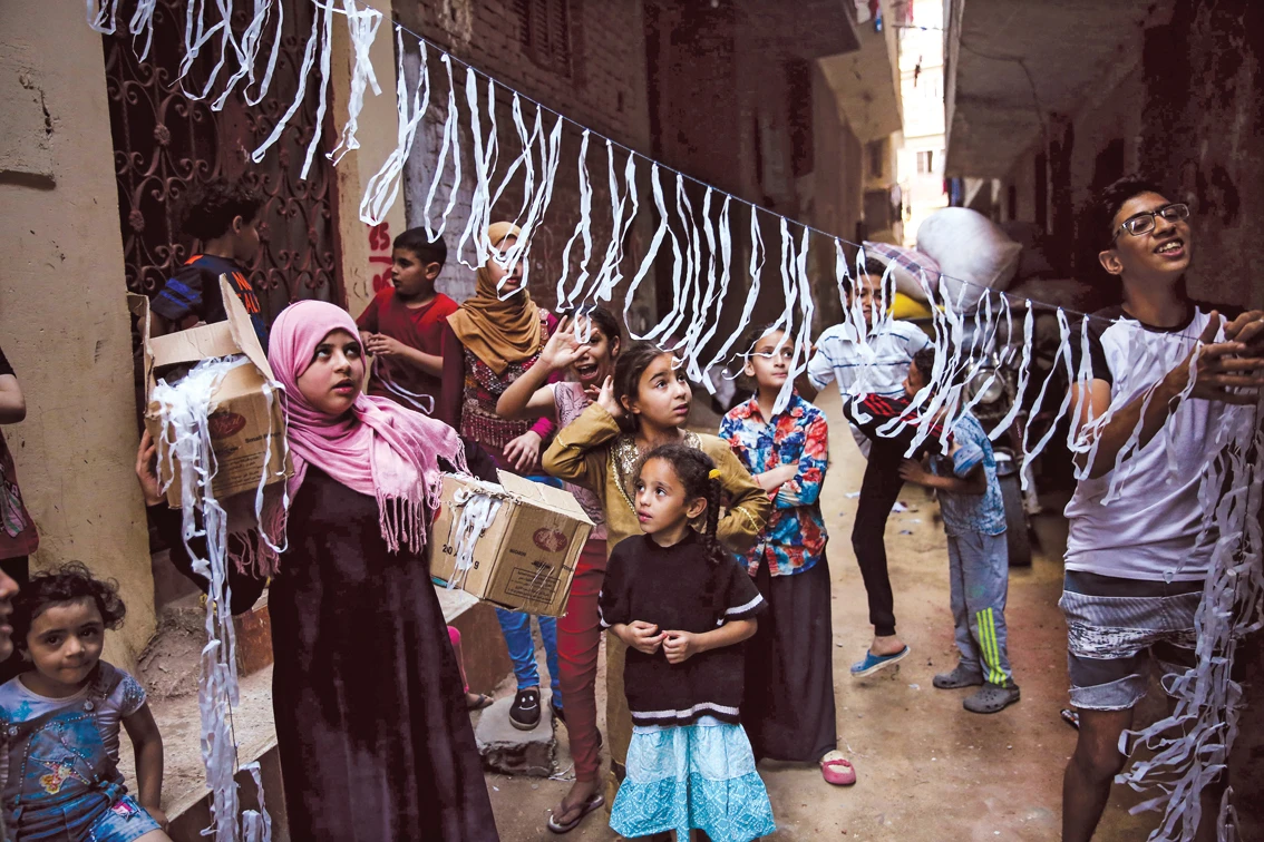 Children decorate streets to celebrate the holy month of Ramadan in Al-Beracil village in Giza, Egypt, on May 13, 2018. (Getty Images)