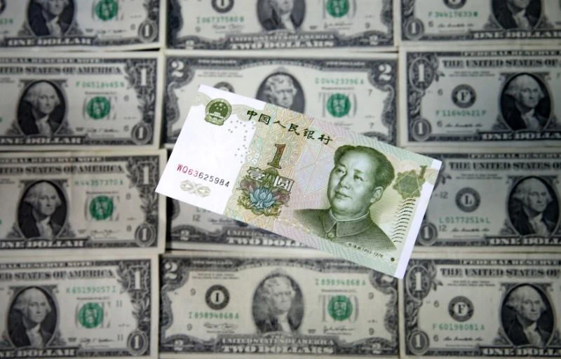 US Dollar and Yuan banknotes are seen in this picture illustration taken May 8, 2017. (Reuters)