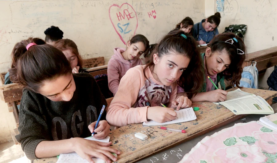 Syrian Kurds reshape region with books and schools