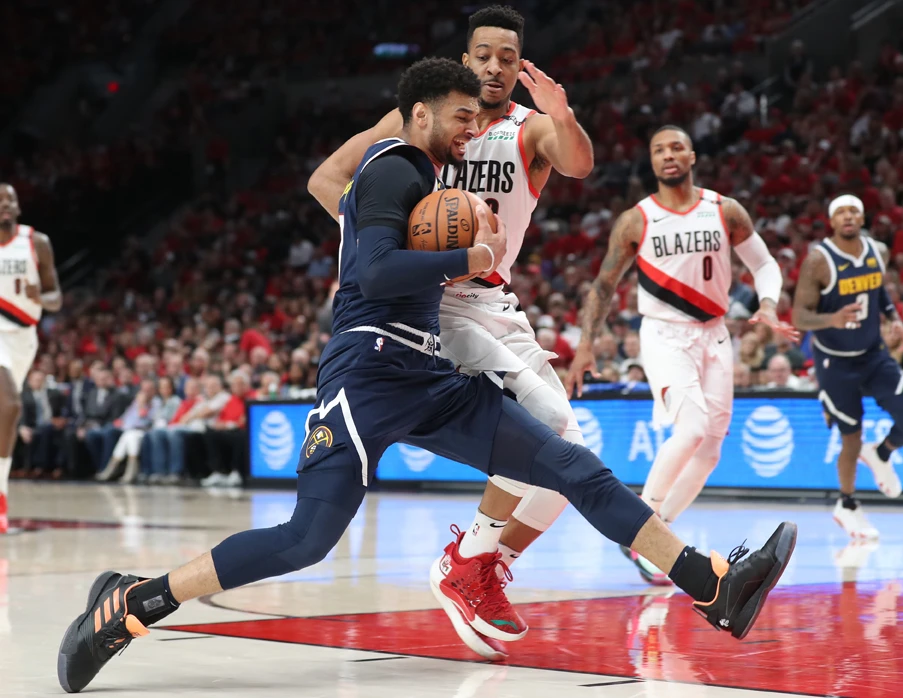 Denver Nuggets guard Jamal Murray drives against Portland Trail Blazers guard CJ McCollum during game four of the second round of the 2019 NBA Playoffs at Moda Center in Portland, Oregon, on May 5, 2019. (Jaime Valdez-USA TODAY Sports)