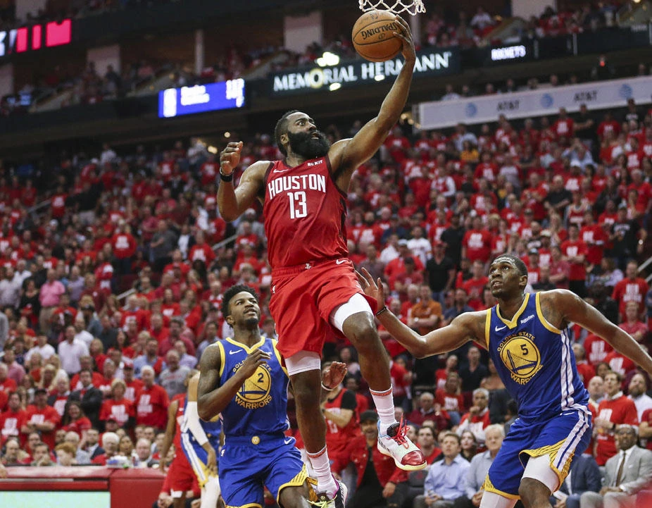 Houston Rockets guard James Harden shoots the ball as Golden State Warriors forward Jordan Bell (2) and center Kevon Looney (5) defend during the third quarter in game four of the second round of the 2019 NBA Playoffs at Toyota Center in Houston. (Troy Taormina-USA TODAY Sports via Reuters)