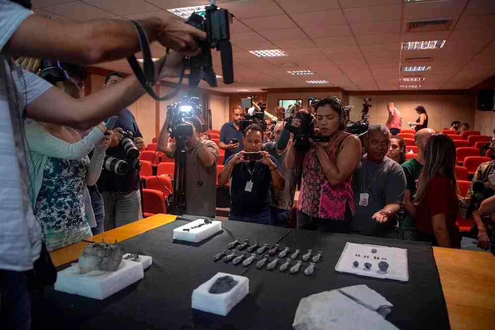 Egyptian pieces found amid the debris of Brazil’s National Museum, destroyed by a fire last year, are displayed during a press conference in Rio de Janeiro, Brazil on May 07, 2019. (AFP)