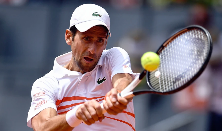 Serbia’s Novak Djokovic in action against Taylor Fritz of the US in the ATP Madrid Open on Tuesday. (AFP)