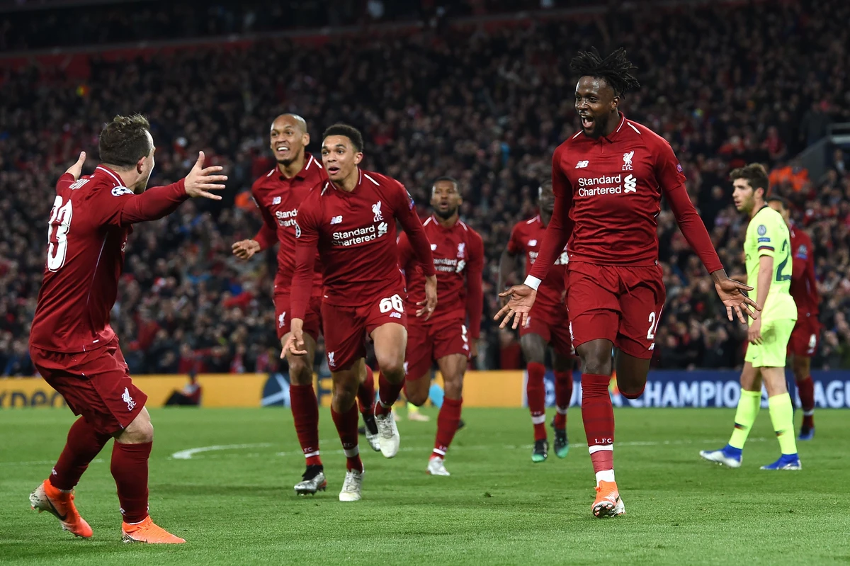 Liverpool’s Belgian striker Divock Origi celebrates after scoring their fourth goal during the Champions League semi-final second leg between Liverpool and Barcelona at Anfield. (AFP)