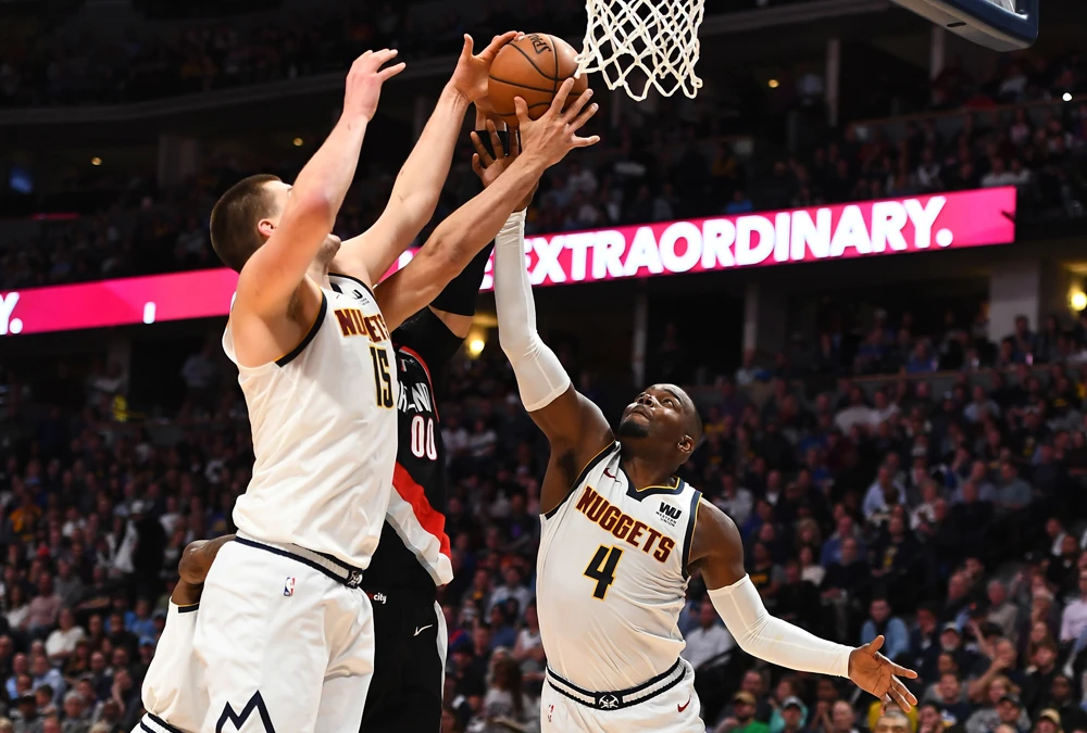 Denver Nuggets center Nikola Jokic (15) and forward Paul Millsap (4) block a shot by Portland Trail Blazers center Enes Kanter (00) in the second quarter in game five of the second round of the 2019 NBA Playoffs at Pepsi Center in Portland, Oregon. (Ron Chenoy-USA TODAY Sports)