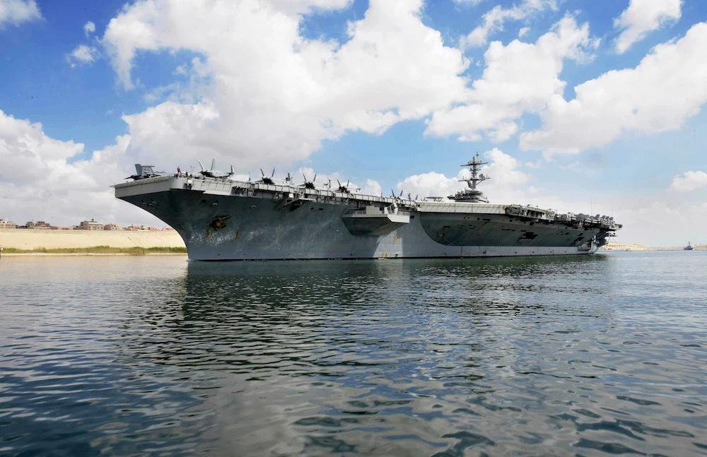The USS Abraham Lincoln sails south in the Suez canal near Ismailia, Thursday, May 9, 2019. The White House said Wednesday it dispatched the aircraft carrier and B-52 bombers to the Gulf over what it described as a new threat from Iran. (Suez Canal Authority via AP)
