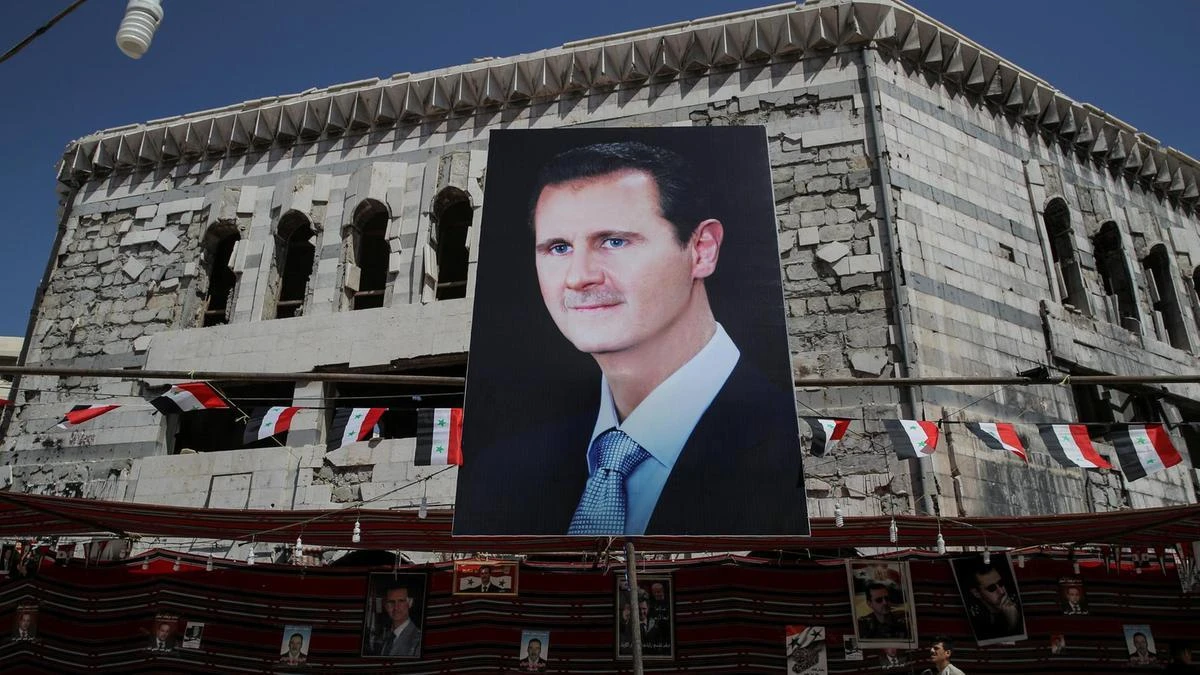 A banner depicting Syrian president Bashar Assad in Douma, 10 km northeast of Damascus. For Assad, Syria’s northwestern province of Idlib stands in the way of final victory against the armed opposition. (Reuters)