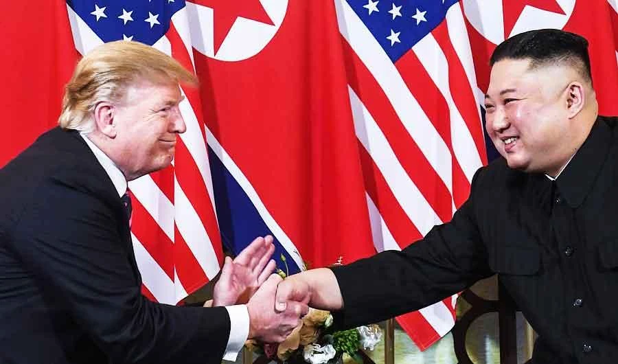 In this file photo taken on February 27, 2019, US President Donald Trump (L) shakes hands with North Korea's leader Kim Jong Un following a meeting in Hanoi. (AFP)