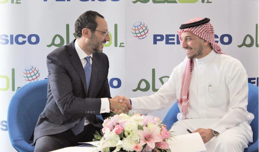 Tamer Mosalam, VP and general manager of PepsiCo, left, and Nasser Al-Zamil, a member of the Saudi Food Bank.