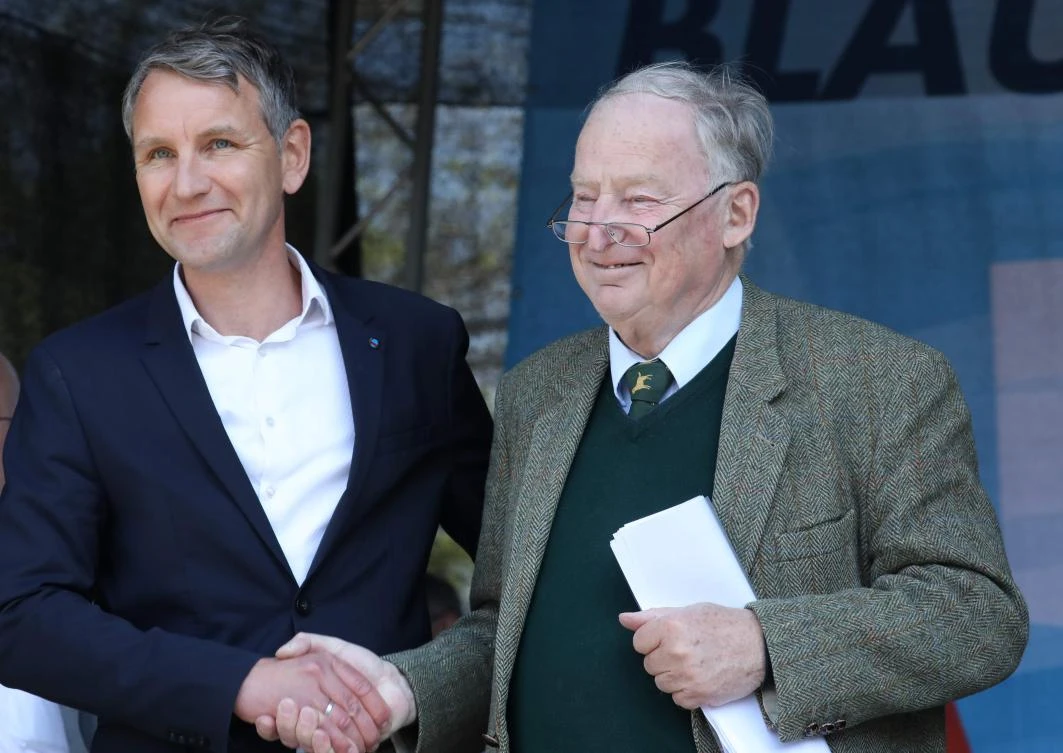 Alexander Gauland (R), co-leader of Germany’s far-right Alternative for Germany (AfD) party, shakes hands with Thuringia’s AfD co-leader Bjoern Hoecke, head of the party’s “Der Fluegel” wing, during a Mayday rally on Labour Day, May 1, 2019 in Erfurt, eastern Germany. (File/AFP/Bodo Schackow)
